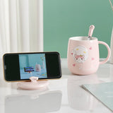 Tasse avec couvercle repose téléphone