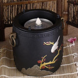 Chauffe Théière <br>en Fonte