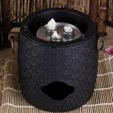 Chauffe Théière <br>en Fonte