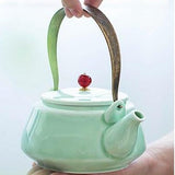 Théière en Porcelaine avec anse métal