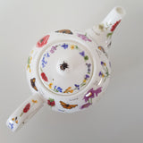Théière motif fleurs et insectes