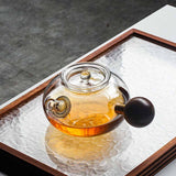 The side glass boiling teapot is high temperature resistant and thickened filter brewing teapot walnut tea warmer kettle